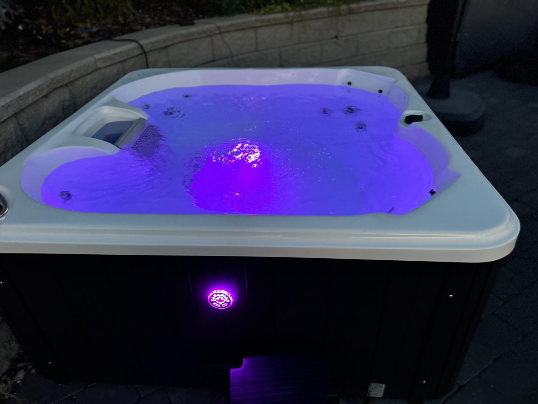 Hot tub lit at night